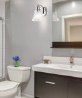 Bathroom with a 4 Light LED Vanity Light Fixture In Brass Gold And Oil Rubbed Bronze With Clear Glass Shade above mirror