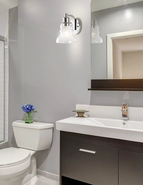 Bathroom with a 4 Light LED Vanity Light Fixture In Brass Gold And Oil Rubbed Bronze With Clear Glass Shade above mirror