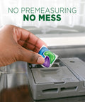 Hand placing ActionPacs Dishwasher Pods With Fresh Scent Go To Grease Fighting Formula for Sparkling Dishes in dishwasher.