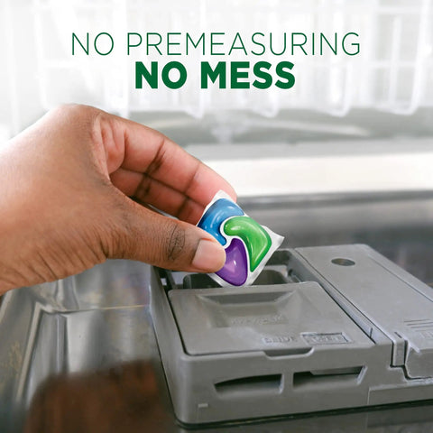 Hand placing ActionPacs Dishwasher Pods With Fresh Scent Go To Grease Fighting Formula for Sparkling Dishes in dishwasher.