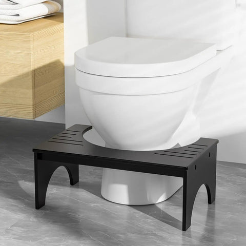 7 Inch Bamboo Toilet Stool For Adults And Kids Poop Stool For Bathroom Use Relieves Bowel Pressure Eases Defecation Anti Slip Grippy Surface Easy Clean Black in front of toilet