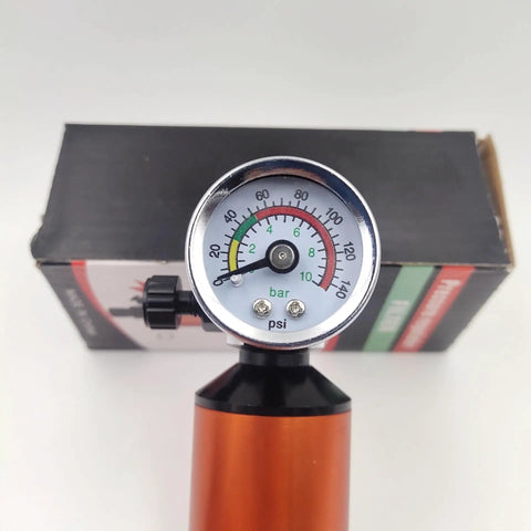 Green Pneumatic Spray Gun Pressure Regulator With Integrated Oil Water Separator And Paint Control Valve 1/4 Inch Thread pressure gauge close-up.