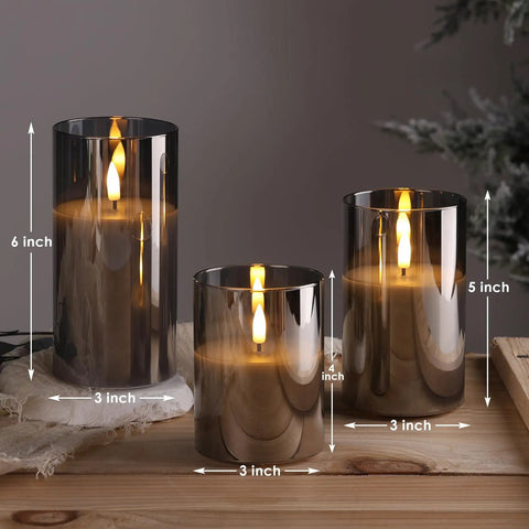 Smoke Grey Glass Flameless Pillar Candles With Remote Control And Flickering LED Battery Candles Set Of 3 on wooden table