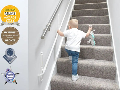 Fully Adjustable Toddler Stair Handrail Built Like A Tank For Little Ones Grows With Your Kid To Deliver Kid Approved Safety And Rock Solid Support Down Each Step Zero Hassle Standard Mount Kit, toddler using handrail on carpeted stairs.