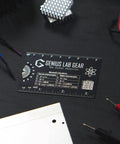 Mini Physics Multi Tool Ruler With Protractor And Compass Stainless Steel Gadget on dark desk with lab equipment