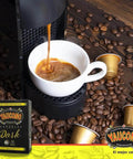 Your Go To Dark Roast Espresso Capsules 18 Count Pack Compatible With Nespresso Machines 100 Percent Puerto Rican Coffee Resealable Box Smooth Balanced Full Bodied Bold Flavor with coffee machine brewing espresso into white cup surrounded by coffee beans and capsule box