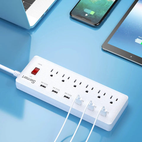 Six Outlet Surge Protector Power Strip With Six USB Ports And Six Foot Heavy Duty Extension Cord in use on desk with devices