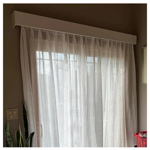 Heavy Duty Ceiling Curtain Track System With Smooth Silent Pulleys And Double Aluminum Runners Paired With A Slick Cornice Cover For Total Blackout and sheer curtains.