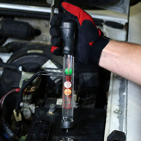 Mechanic using Pro Grade Battery Hydrometer Tester With Floating Disc Specific Gravity Readout For Cars And Golf Carts 16.25 Inch Auto Battery Tester Easy To Read State Of Charge Gauge For Quick Battery Maintenance in a car engine bay.