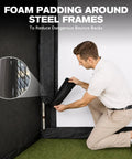Person adjusting foam padding on steel frame of All In One 10x8ft Golf Simulator Enclosure With Hitting Net HD Impact Screen
