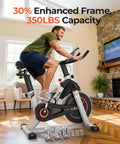 Side view of YOSUDA magnetic indoor exercise bike in a home living room; grey frame with tablet holder.