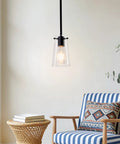BESTWEST 3 Pack Pendant Lights Kitchen Island, clear glass pendant light hanging with matte black finish in a cozy interior.