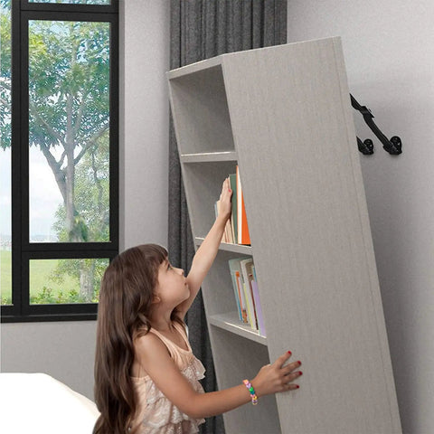 Child reaching for bookshelf secured by heavy duty anti tip straps for TVs and furniture dual safety straps with metal plates kid proof.