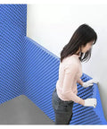 Top Shelf Self Adhesive Soundproofing Egg Crate Foam being applied to walls, heavy duty blue acoustic wedge panels for better sound.