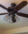 Premium Black Metal Wire Cage Lamp Guard For Ceiling Fans And Pendant Lights Killer Diamond Shape Light Cover With Slick Rust Resistant Coating Set Of Two on a ceiling fan.
