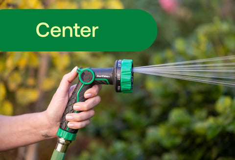 Thumb Control Garden Hose Nozzle With Eight Spray Patterns Carbon Fiber Texture Non Slip Grip being used in center spray