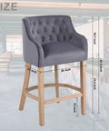 Grey suede counter height stool with natural wood legs, 24-inch tall, button-tufted backrest, shown in a modern kitchen setting
