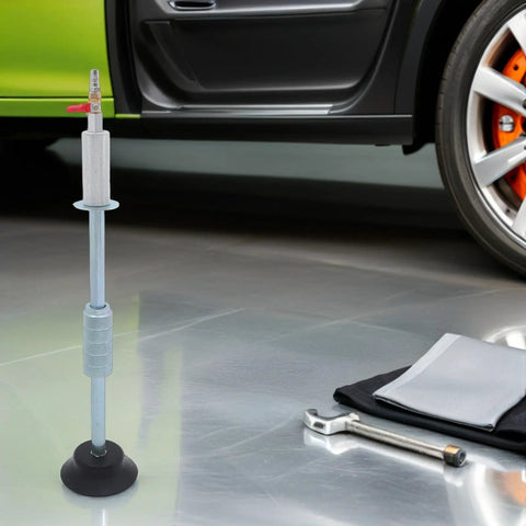 Pneumatic Dent Puller Tool Kit For Car Repair With Heavy Duty Suction Cup Instant Dent Correction Vacuum Powered Dent Removal For Auto Body 23.97 X 4.72 Inch Portable Pro Grade Car Fix Kit on floor beside car