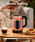 Electric Tea Kettle With Temperature Control And Glass Body For Tea And Coffee Daily Driver Smart Water Boiler on wooden table.