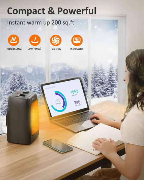 Compact Ceramic Space Heater With 1500W And 900W Modes, heating a small desk area next to a laptop in a wintry room.
