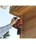 Badass 18V Cordless Orbital Sander With Killer Dust Control And Super Smooth Softgrip Handle For Hassle Free Wood Projects 12,000 Opms Compact Orange Design Includes Four Piece Accessories Set For Top Shelf Finishing Results in use on wooden trim.