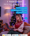 Woman using laptop to control Smart RGBWW WiFi LED Bulbs with voice commands for Alexa and Google in a cozy room.