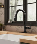 Premium Vintage Kitchen Faucet Featuring A Smooth Pull Down Sprayer And Heavy Duty Oil Rubbed Bronze Finish on a kitchen sink.