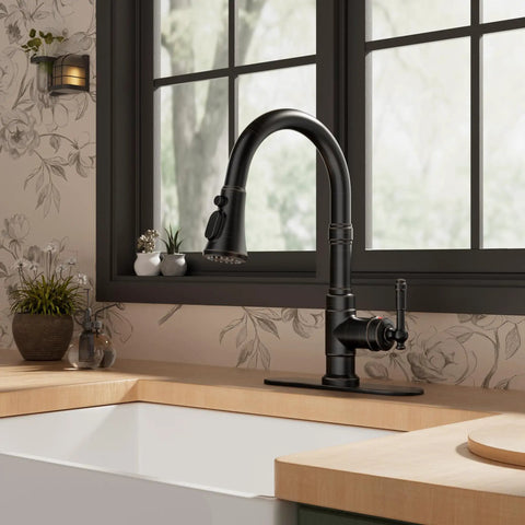 Premium Vintage Kitchen Faucet Featuring A Smooth Pull Down Sprayer And Heavy Duty Oil Rubbed Bronze Finish on a kitchen sink.