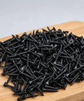 Go-To Drywall Screws Kit With 220 Black Wood Screws In 5 Sizes For Sheetrock And Picture Frames on wooden board