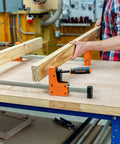 Heavy Duty 36 Inch 90 Degree Parallel Steel Bar Clamp For Woodworking And Cabinet Build With Multi Plate Clutch Mechanism in use holding wood.