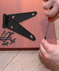 Installation of 2 Pack Heavy Duty Strap Gate Hinges With Screws Galvanized Iron Outdoor Fence Hinges on wood surface