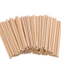 Premium Unfinished Natural Wood Dowel Rods 100 Pack Of Six By One Quarter Inch Smooth Cylinders For Arts And Crafts stacked in a pile.