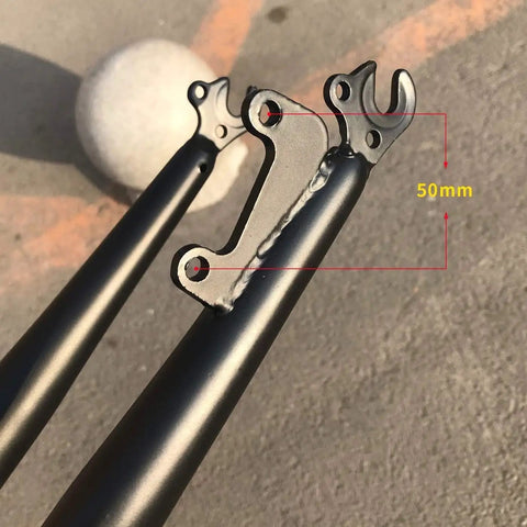 Close-up of the Beefy 26 Inch Steel Threadless Bike Fork's disc brake mounts, 1 1/8 inch steerer, black, for MTB or road use.
