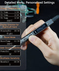 Hand holding programmable PD DC soldering iron with OLED display showing detailed menu settings