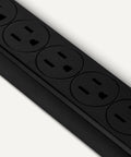 Dead Simple Dual Pack Six Outlet Surge Protector Power Strip With Six Hundred Joule Protection Circuit Breaker Safety Shutters And A Sleek Two Foot Black Cord For Desk Setup, showing a close-up of six black outlets.