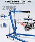 Professional Two Ton Folding Hydraulic Engine Hoist With Six Swivel Wheels And Adjustable Boom Cherry Picker lifting an engine with adjustable height.