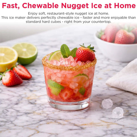 Glass of cocktail with strawberries and mint on countertop, showcasing ice from Touchscreen Nugget Ice Maker For Countertop With 33 Lbs Daily Capacity, Easy Tap Control, Sonic Style Crunchy Ice For Cocktails And Sodas, Sleek Slate Finish, Home Bar Essential.