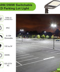 Total Game Changer Dusk To Dawn Led Parking Lot Light illuminating a large empty parking lot at night with crisp 5000K glow.