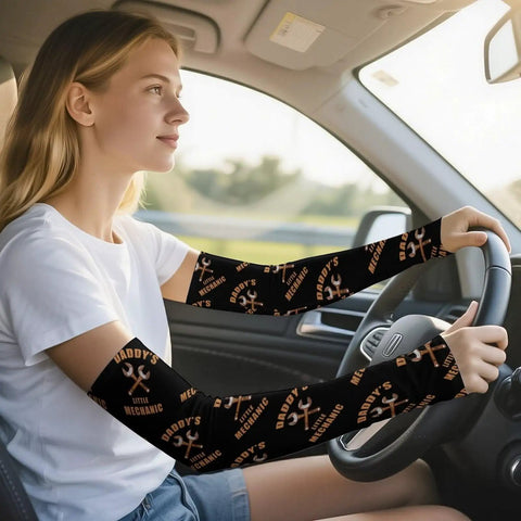 Top Tier Cooling Arm Sleeves In Breezy Ice Silk For Men And Women Featuring Secure Anti Slip Thumb Loops worn while driving.