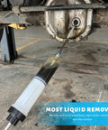 500cc Manual Automotive Fluid Extractor Pump With Two Durable Extension Tubes in use for quick oil drainage from a vehicle.