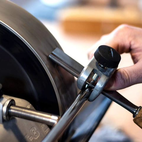 Person using Short Tool Jig For Sharpening Short Wood Chisels Carving Gouges And Power Carver Bits That Keeps Tools Square