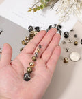 Rock Solid Gold Tone Leather Rivets With Ball Head Studs And Quick Spin Chicago Screws For Handbag Repair Belt Mending And Custom Craft DIY Projects That Set Up Without A Sweat And Deliver Pro Results Every Time, shown in hand.