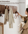 Woman using Walnut Wood Coat Rack Wall Mount With Eight Retractable Hangers And Two Dedicated Key Hooks in entryway