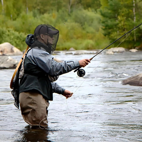 Person fishing in river wearing Mosquito Head Net With Drawstring Extra Fine Mesh Breathable Shield For Camping Hiking Fishing Fits All Hats Men And Women Gray Lightweight See Through.