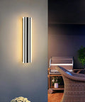 23.6 Inch Modern Outdoor Wall Sconce With 12W LED Black Exterior Light Fixture Frosted White Acrylic Porch Patio Waterproof IP65 for Garage Front Door Garden Tough As Nails illuminating a patio area.