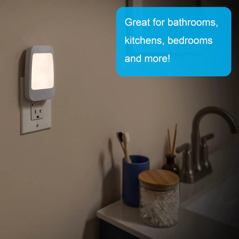 Four In One LED Power Failure Night Light With Dusk To Dawn Sensor in bathroom wall outlet next to sink and toiletries.