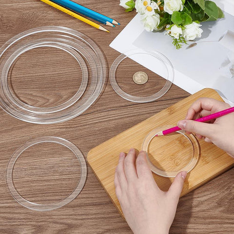 Eight Piece Circle Router Template Set For Woodworking, clear acrylic inlay guides varying sizes, used for precise inlays on wood.
