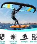 Inflatable Surf Wing 4m2 5m2 6m2 With Window Handheld Foil Wing Kite used by person on water, includes storage bag and surf leash.