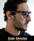 Man wearing anti fog safety glasses with side shields, demonstrating ANSI Z87.1 eye protection and clear lenses design.