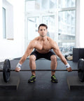 Man performing barbell deadlift on Deadlift Drop Pads Pair For Quiet Home Gym Lifts, Noise Reducing Heavy Duty Weightlifting Mats.